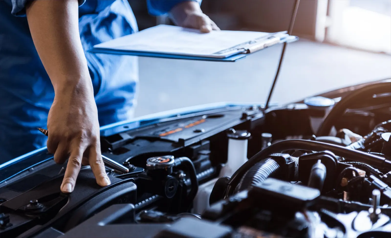 Technician working on an engine