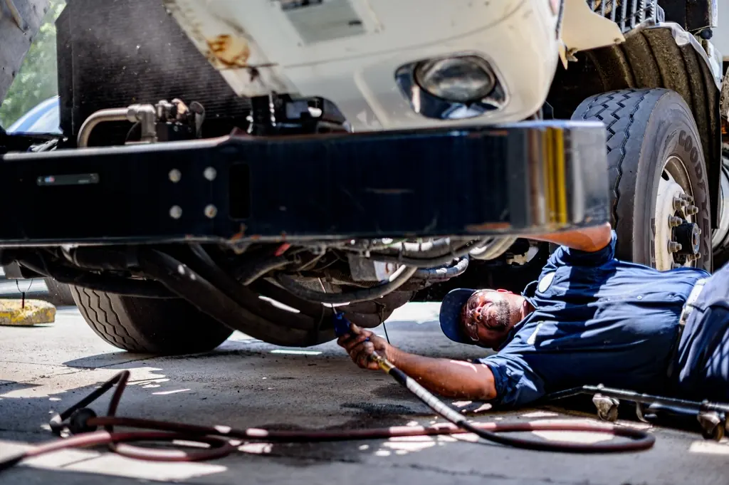 Technicians working on a vehicle