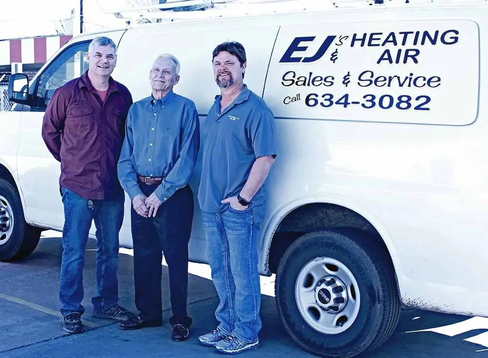 EJ's technicians with a service van