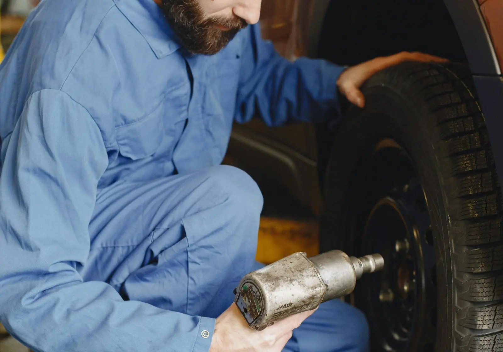 Technician mounting a tire