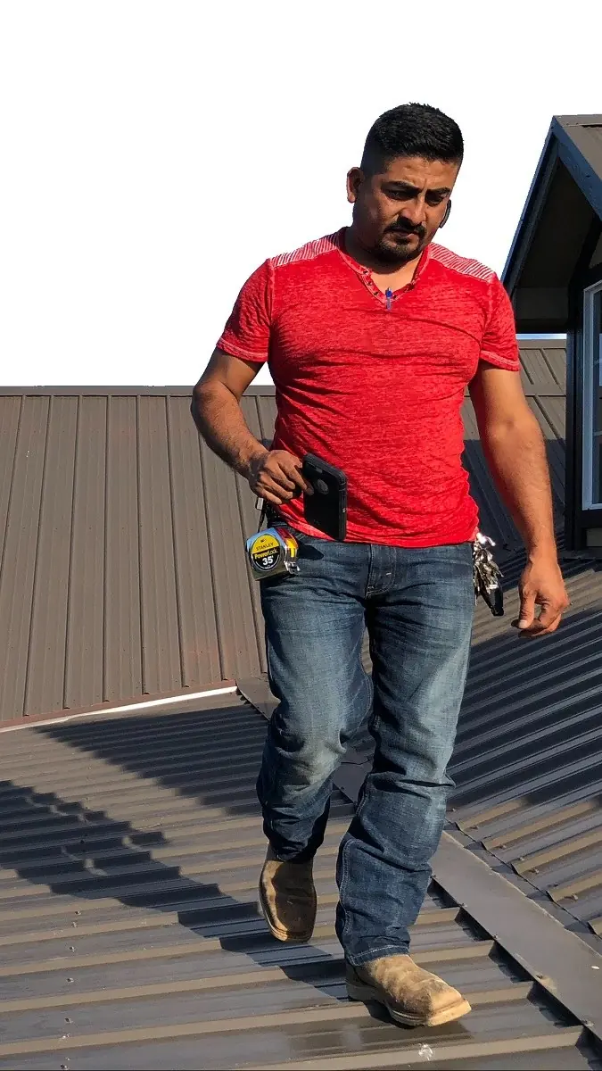 Pizano crew member on a roof
