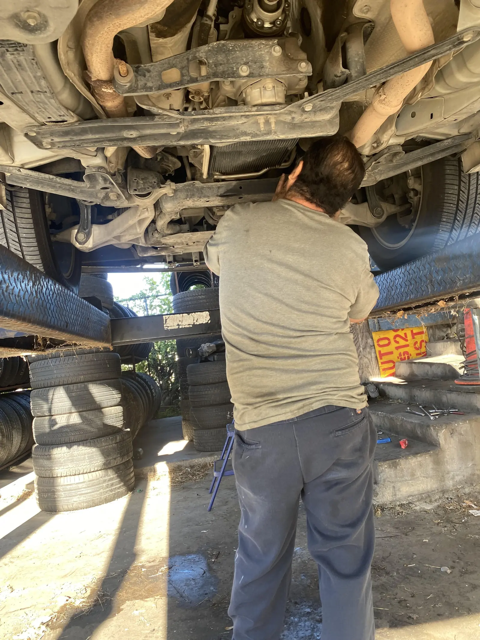4G's technician working under a vehicle
