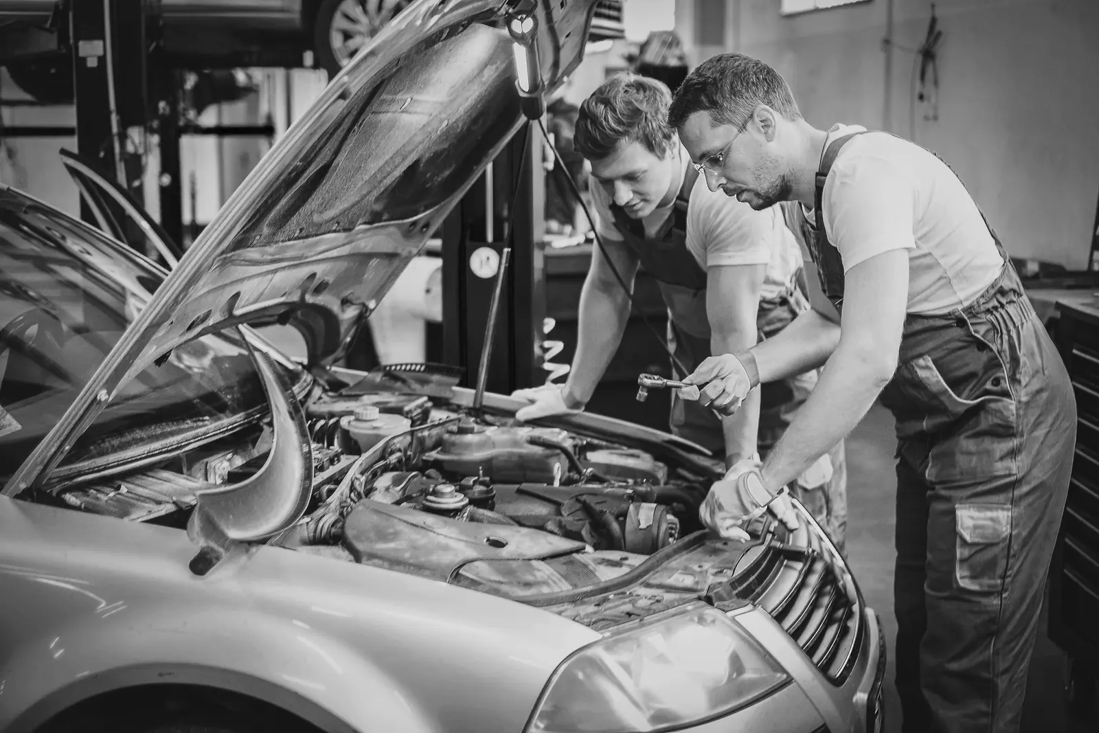 Mechanic working under the hood
