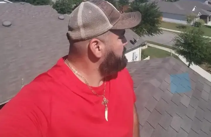 Hugo Guerra of HG Roof Repair on a roof in San Antonio